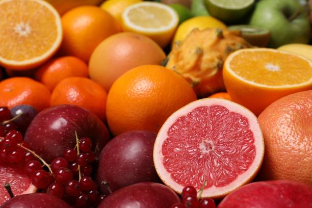 istock Different ripe fruits and berries as background, closeup 1828891525