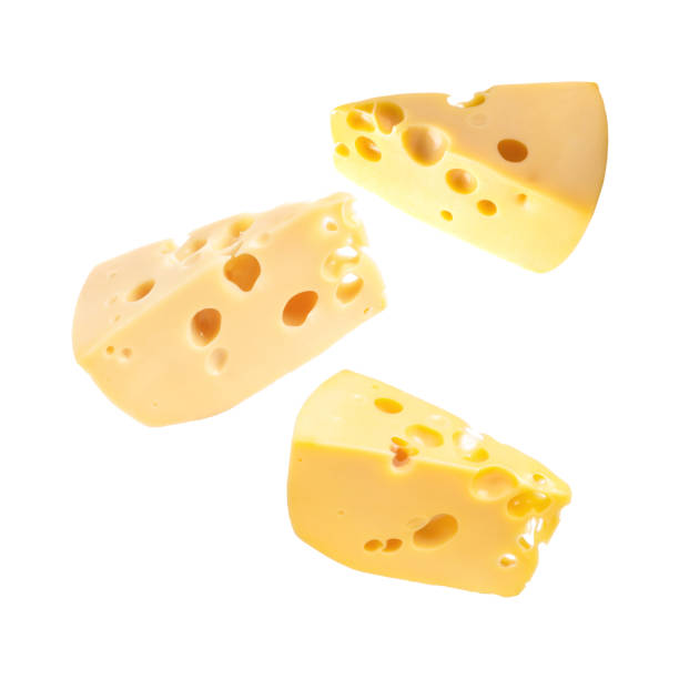 istock Pieces of tasty cheese falling on white background 1828892713