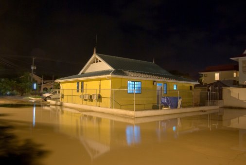 Public building at night and flood waters