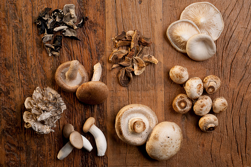 Mushrooms assortment in a wooden table.