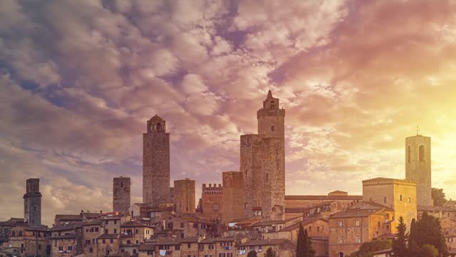 Tuscan Tranquility: Sunrise Casting a Warm Glow on San Gimignano - Illuminated Towers and Old Houses