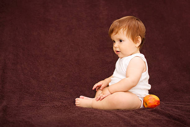 Child and an apple stock photo