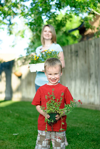 istock Happy boy holding flowers 182890713