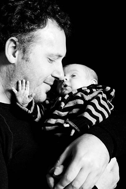istock Father with Newborn Baby Daughter 182890967