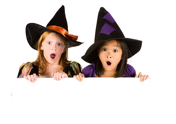 cute little witch with a signboard.