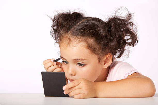 istock Lovely little girl making makeup 182891136
