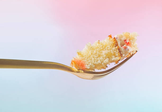 istock A Delicious Bite of White Cake on a Gold Fork 1828914530