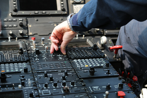 Airplane pilot handling the controls and doing the checking list prior to takeoff