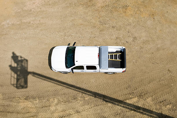4x4 pick up vehicle transporting a container in its loading area. Concept: 4x4/pick up vehicle