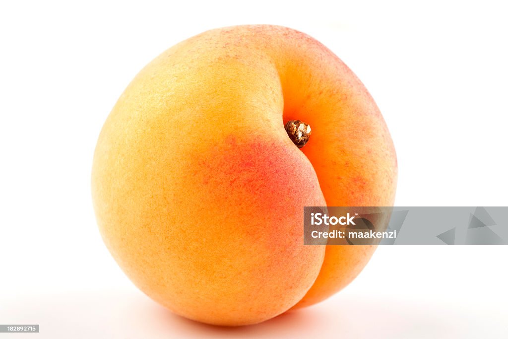 Close-up of a yellow-red apricot isolated on white single ripe apricot isolated on white Apricot Stock Photo