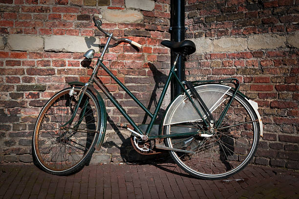 istock Retro Bicycle Against Brick Wall in Amsterdam 182893099