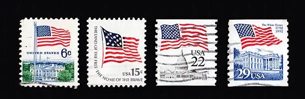 Photo of Four first class stamps with American flags