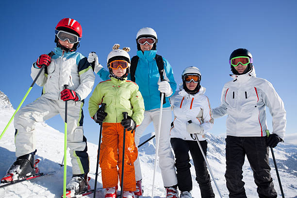 istock skiers at blue sky close 182893925