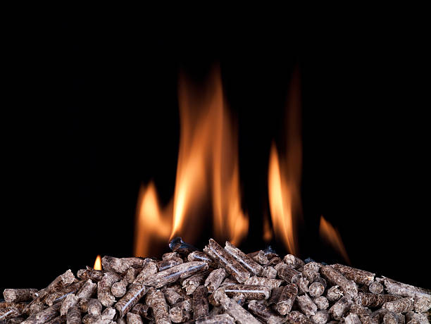 Wood pellets burning stock photo