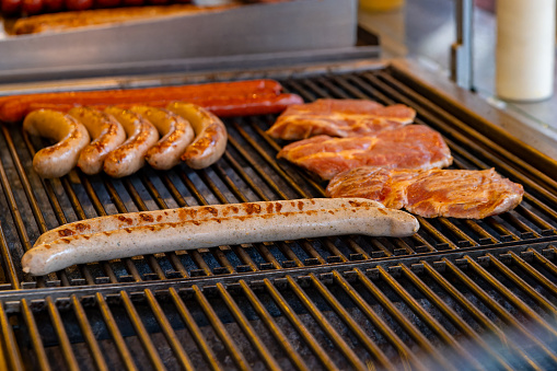 a barbecue in winter with sausages in selective focus