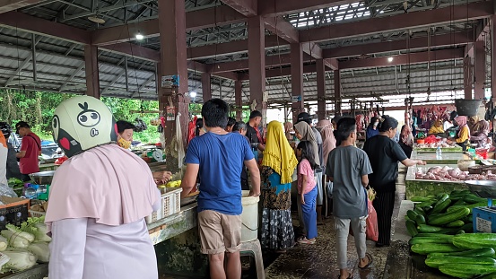 Bangka Belitung , Indonesia - 3 December 2023 : The condition of the Bangka Traditional Market is busy on Sundays with many people shopping for basic necessities