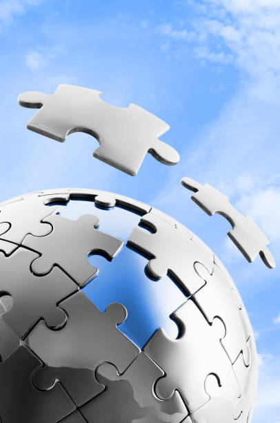 istock Global jigsaw puzzle with two pieces suspended above 182894630