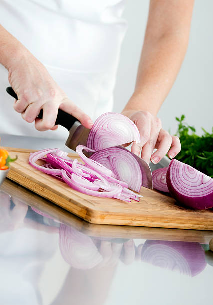 istock Food Preparation - Cutting a Red Onion 182895046