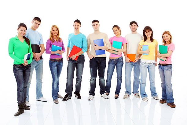 istock Group of a students with books standing in row. 182895362