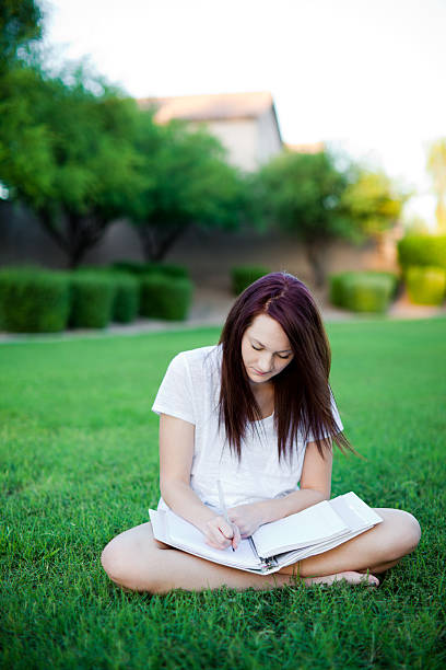 istock Girl studying in the park. 182895396
