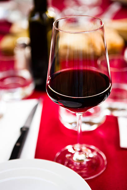 istock glass of red wine ,dining table 182895441
