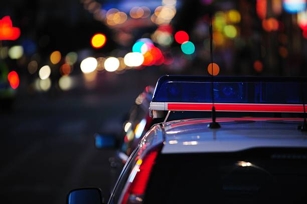 istock Police car reflecting night lights 182895556