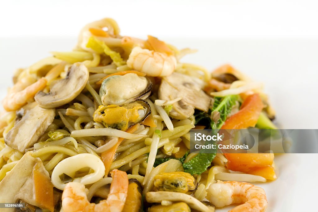 Seafood Stirfry "Detail of a plate of seafood stirfry with prawns, mussels, calimari, beansprouts, mixed vegetables and noodles in chinese sauce." Bean Sprout Stock Photo