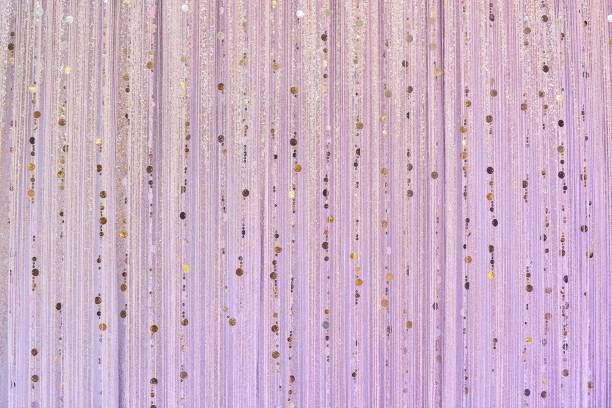 istock Decorative fluffy soft threads like a curtain in the rays of artificial light. Handmade decoration of rooms for the holiday. 1828963654