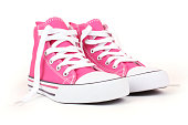 Pair of pink canvas sneakers with white laces