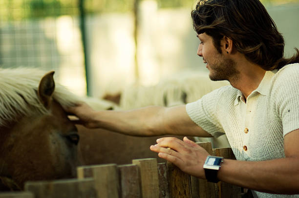 istock Attractive male and horse 182897320
