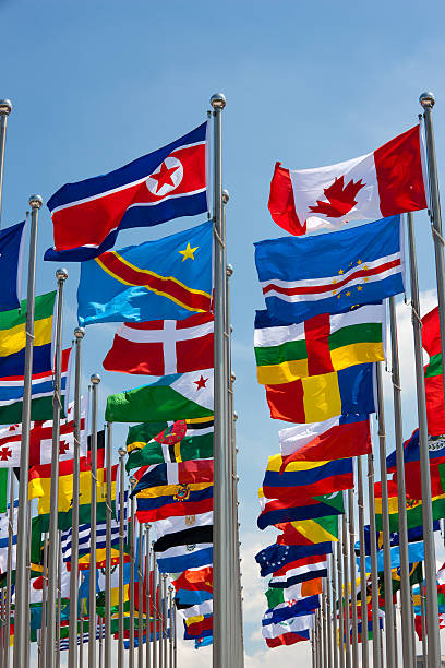 istock Different flags of various countries flying from a flag pole 182897787