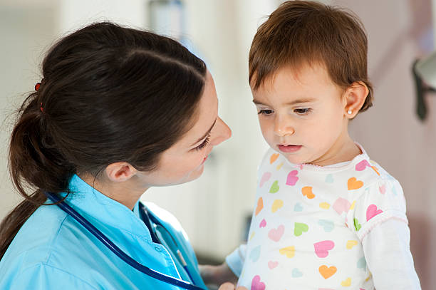 istock Pediatrician looking at Baby 182897904