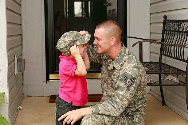 Military dad having fun with his son.