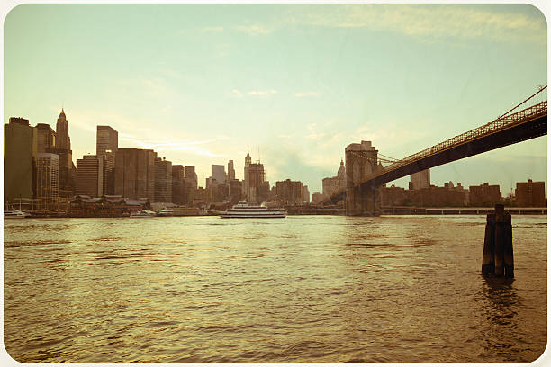 Greetings from New York Vintage Postcard Retro "Vintage retro styled postcard. View from Brooklyn to New York City skyline and Brooklyn Bridge. Cross-processed, added dust and scratches." brooklyn bridge photos stock pictures, royalty-free photos & images
