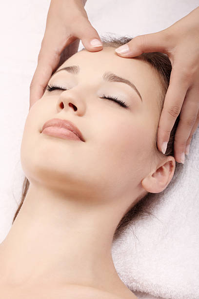 istock A woman receiving a head massage 182899079