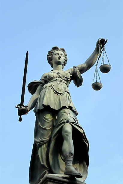 istock Statue holding a sword and the scales of justice 182899193