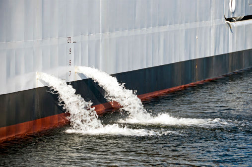 Ballast water pouring from ship