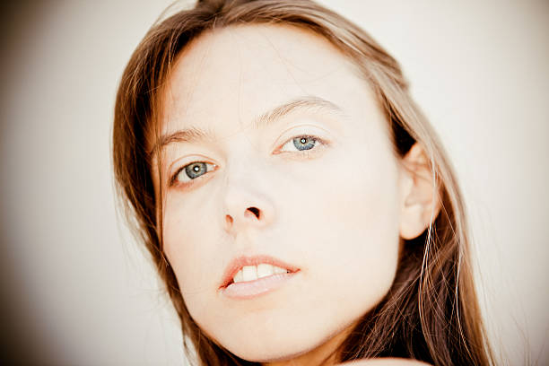 istock Young woman looking at camera 182899808