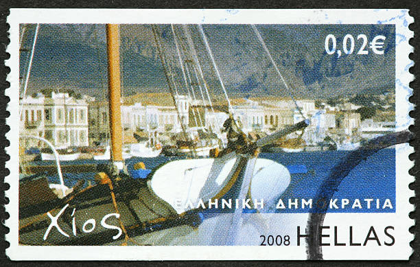 istock sailboat and Greek seaside city 182900303
