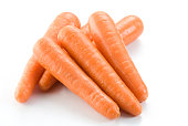 Stack of fresh clean carrots isolated on white background