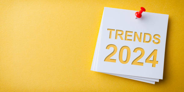 istock Trends 2024 Word in White Sticky Note on Yellow Cardboard Background 1829005802