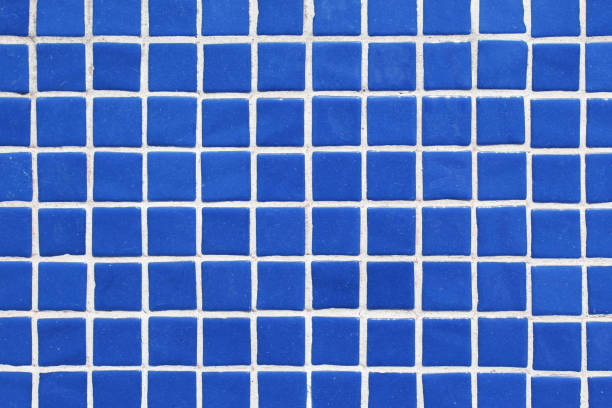 istock Blue square ceramic tile background. Swimming pool texture. Geometric wall decoration. Home bathroom floor. Ornamental patchwork. 1829007934