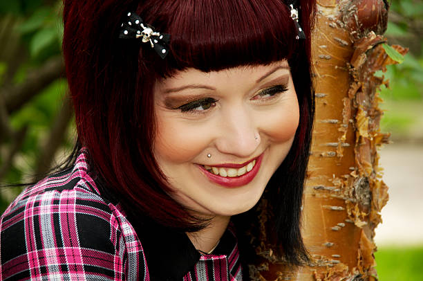 istock Pin-up girl smiles outside. 182901616