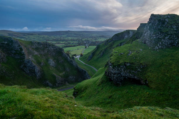 istock Stunning dramatic early Autumn dawn landscape image viewed along Winnats Pass in Peak District England 1829016916
