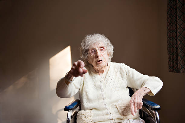 103-Year-Old Woman Points at Camera Candid of a 103-year-old woman in a wheel chair pointing at camera as she gives advice.Please see some similar pictures from my portfolio: over 100 stock pictures, royalty-free photos & images