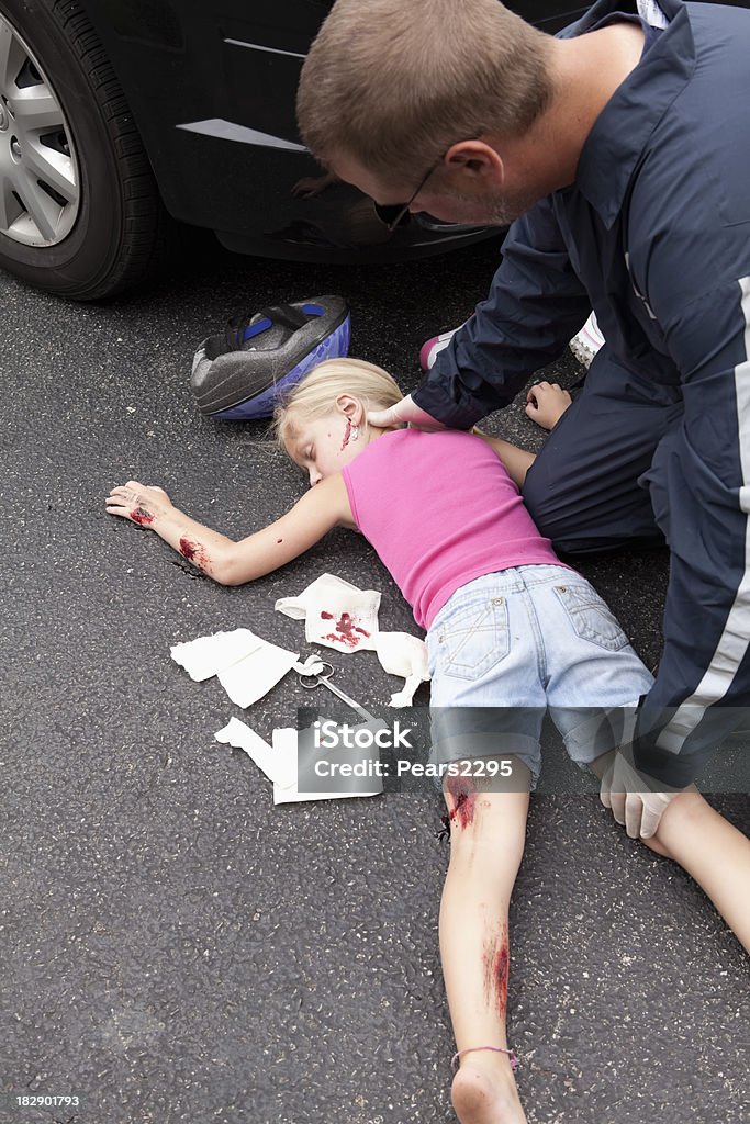Litle Girl Hit by car Series Little girl after she has been hit by a car while riding a bikeCheck out my Tragedy Series Child Stock Photo