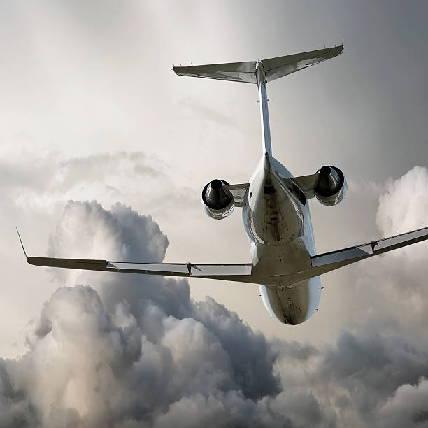 istock corporate jet airplane taking off in storm 182902429