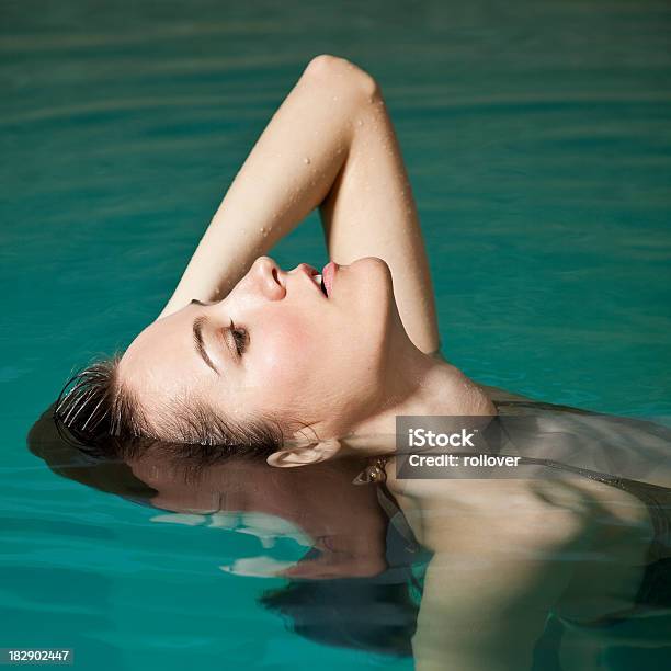 Woman Floating Stock Photo - Download Image Now - Summer, Swimming Pool, 20-24 Years