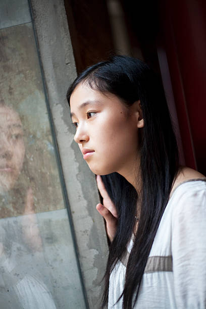 istock Asian girl inside the window 182902979