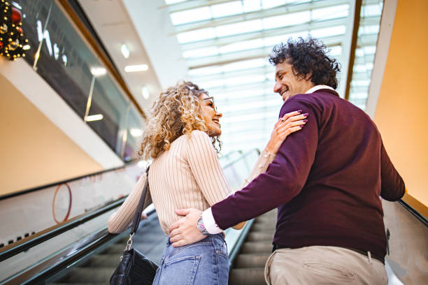 istock Young couple in the shopping mall 1829031762
